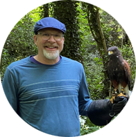 Bob McCready with bird perched on his arm
