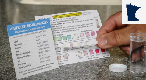 Close up of person conducting water test with small map of Minnesota in top right corner