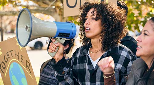 Person speaking into megaphone