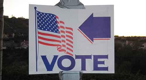 Vote sign with American flag