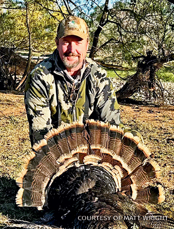 An image of Matt with a turkey.