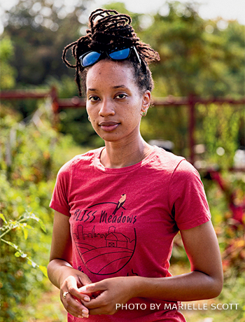 An image of Atiya Wells in the BLISS Meadows grow space.