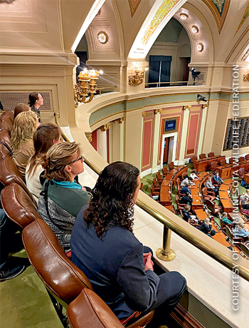 An image of people sitting at a Minnesota Statehouse visit.