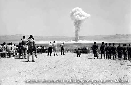 An image of soldiers and cameramen near the Small Boy nuclear test.