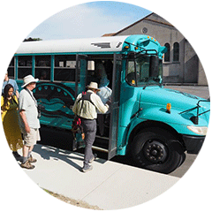 People boarding a bus for a garden tour