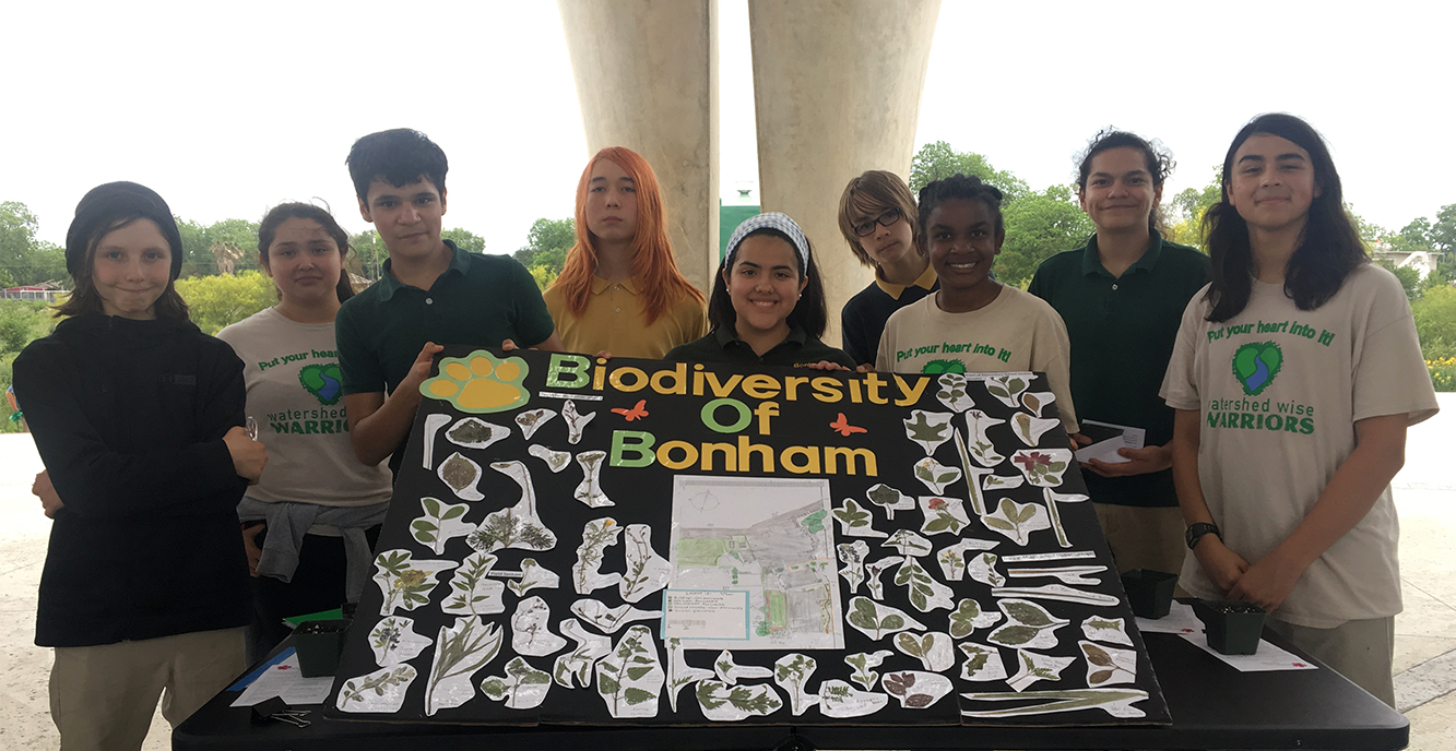 students at Bonham Academy in Texas showing off their diversity poster